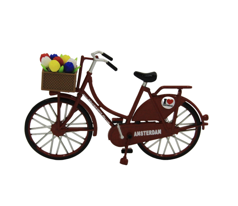 Miniatur-Rotes Fahrrad mit Tulpen