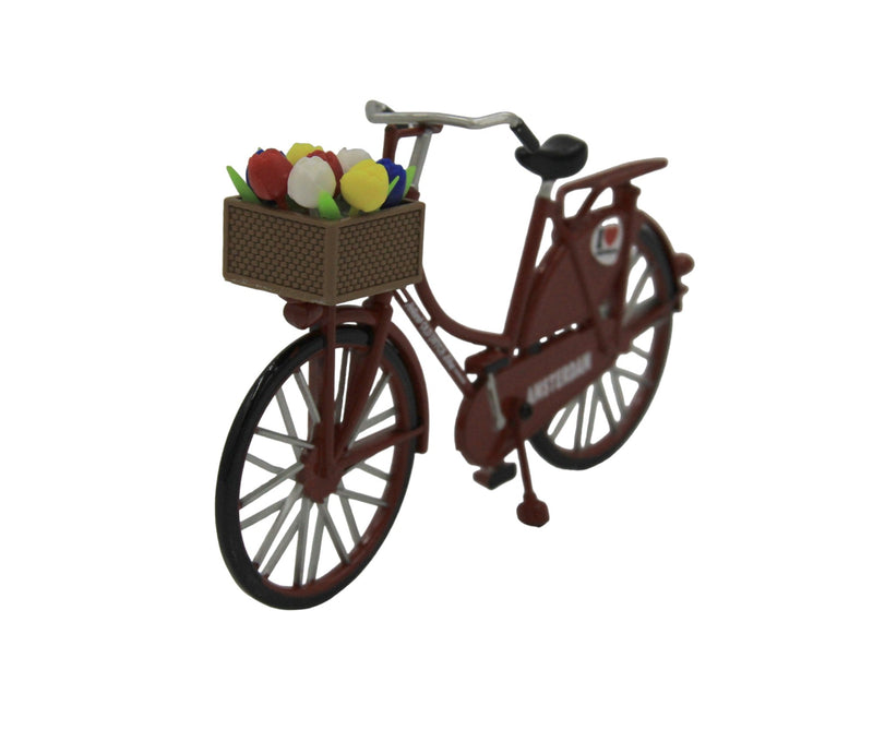 Miniatur-Rotes Fahrrad mit Tulpen